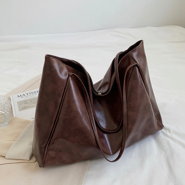 Orla | Schimmernde Lederhandtasche